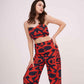 Confident pose in muslin printed co-ord set featuring sweetheart neckline and wide-leg pants with vibrant geometric design.