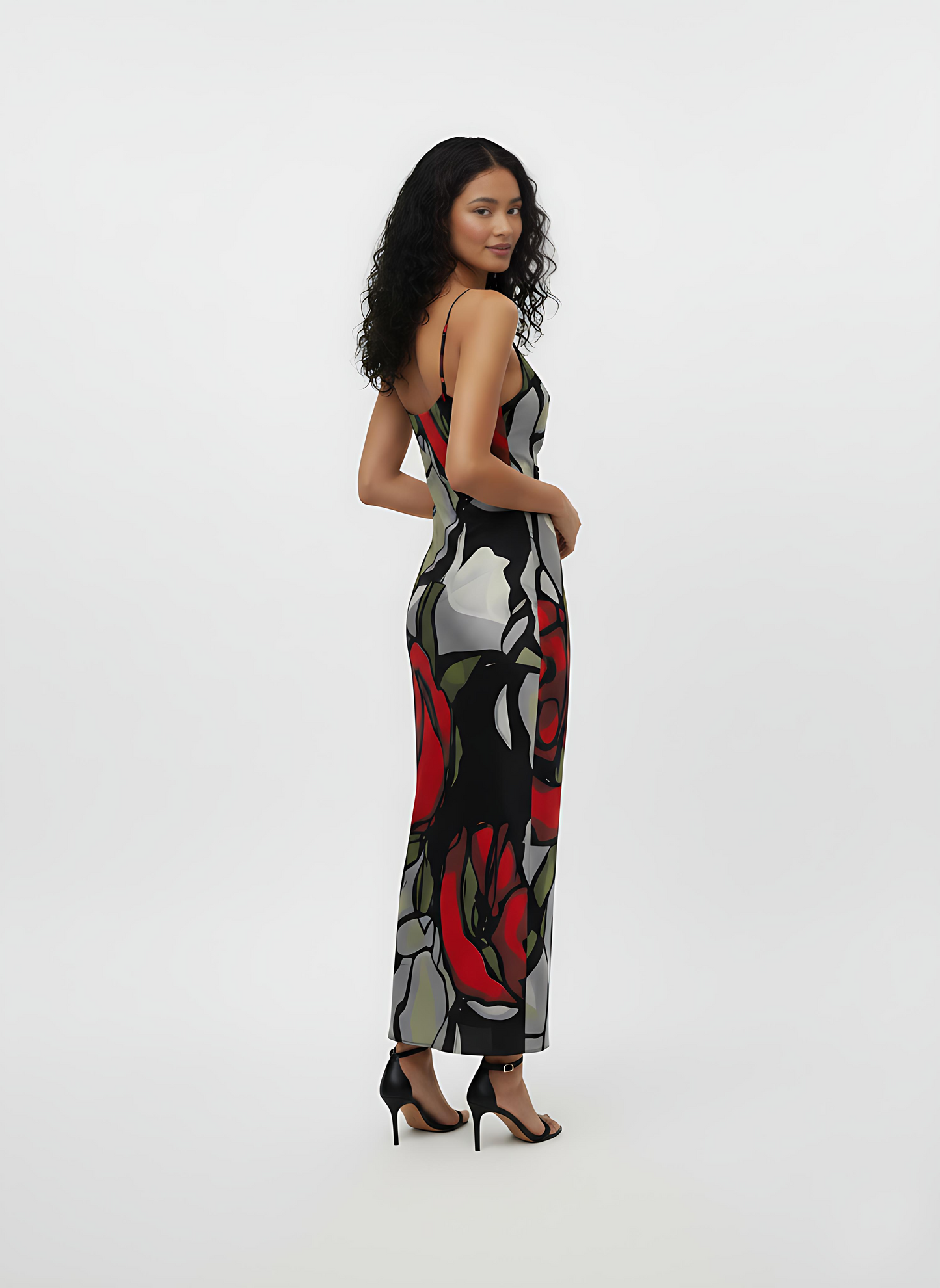 Sleeveless crepe midi slip dress with a scoop neckline, subtle cowl drape, spaghetti straps, and a floral-inspired abstract print.