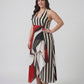 Bold monochrome striped plus-size maxi dress with a crimson red abstract panel