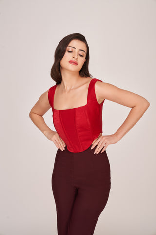Crepe co-ord set featuring a red corset top paired with brown trousers