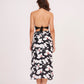 Open back bodice design with a secure tie-up knot detail and a straight-cut printed midi skirt.