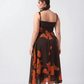 Crepe midi dress with orange abstract print and fluid silhouette, perfect for brunches, daytime gatherings, and evening wear