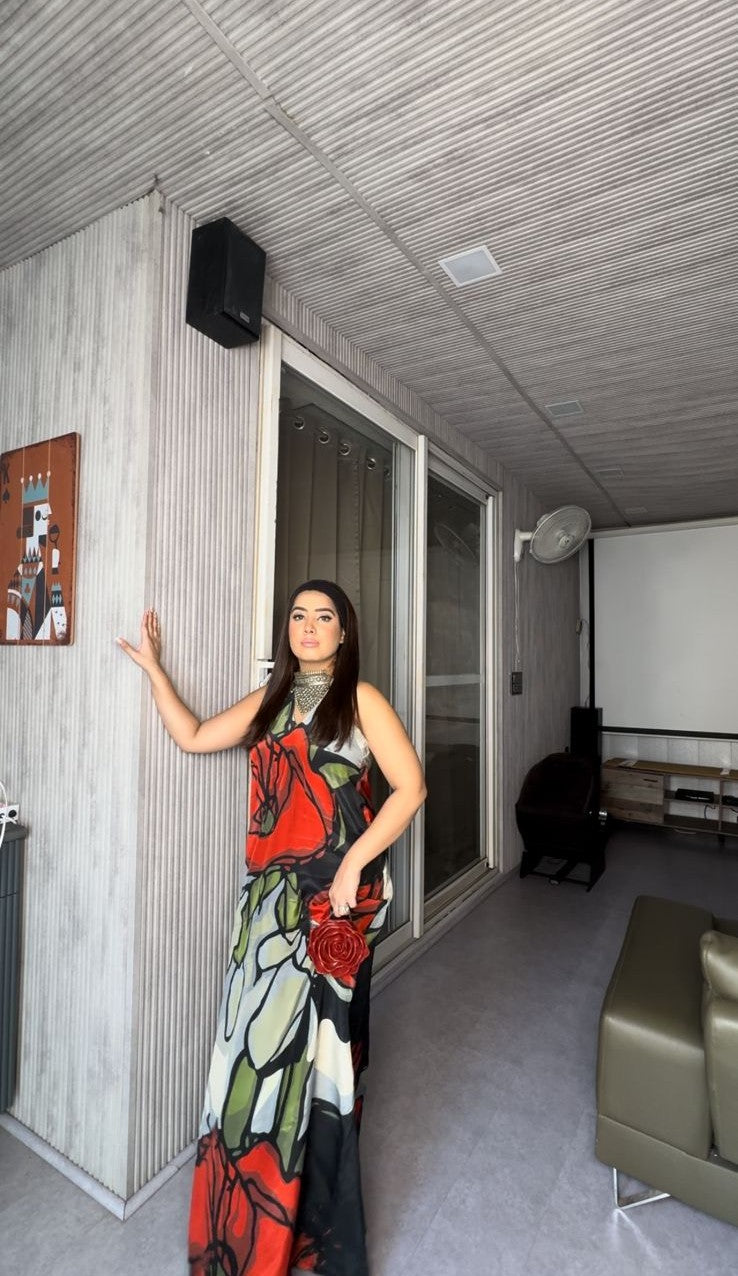 Bold botanical print dress with a sweeping silhouette, ideal for tropical resort wear, summer evening events, or outdoor garden parties.