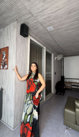 Bold botanical print dress with a sweeping silhouette, ideal for tropical resort wear, summer evening events, or outdoor garden parties.