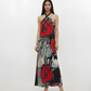 Crepe halter-neck maxi dress with a crossover neckline, straight-fit silhouette, and oversized floral-inspired abstract print in crimson red, black, grey, and sage green.