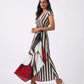 Crimson Élan maxi dress featuring bold black and ivory vertical stripes with a crimson abstract colour-blocked panel.