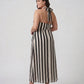 Model wearing a flowing crepe maxi dress designed to move gracefully with every shape