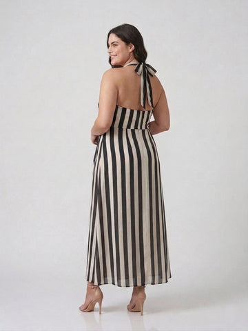 Model wearing a flowing crepe maxi dress designed to move gracefully with every shape