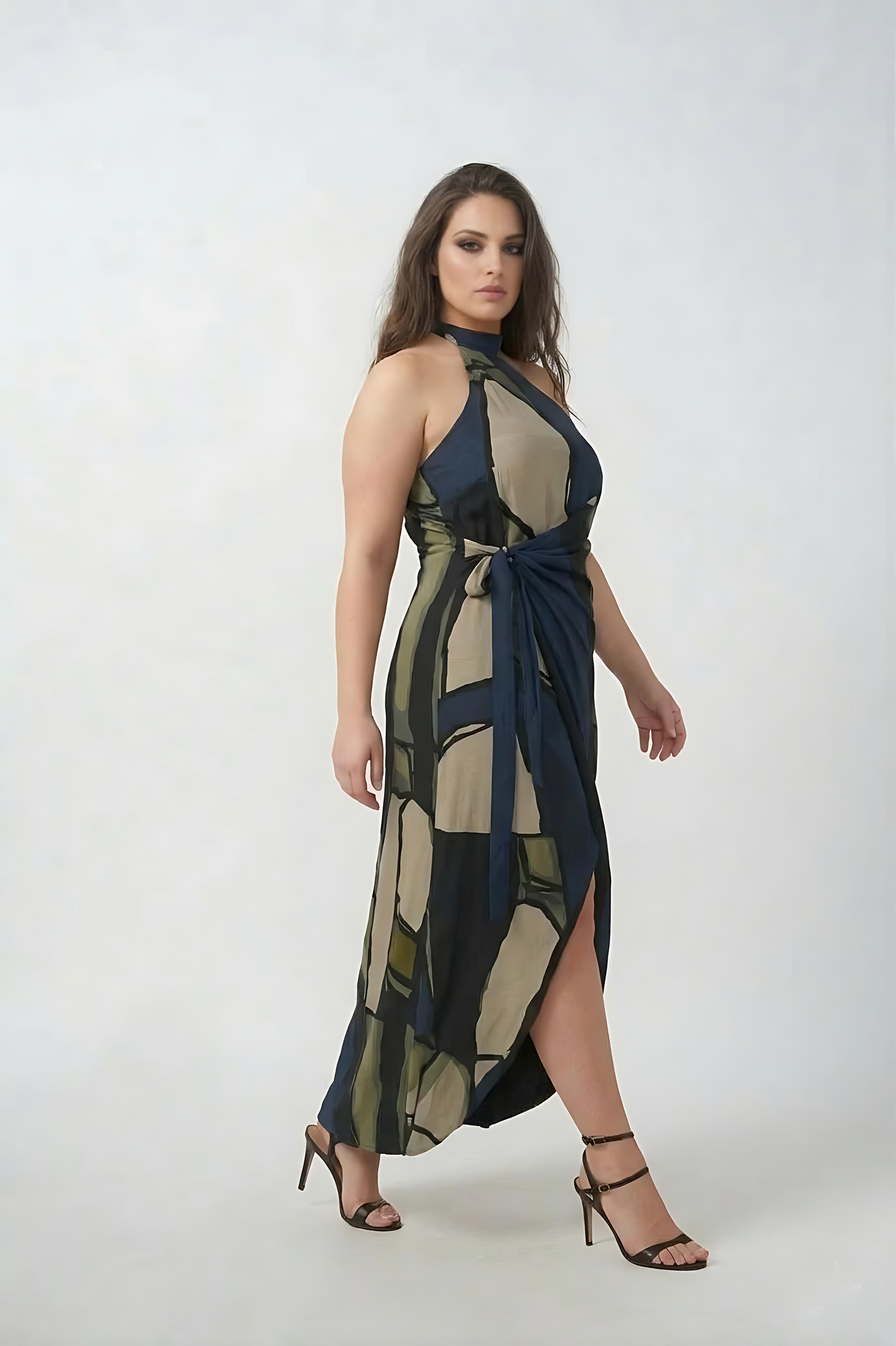 Curve fit crepe dress with a one-shoulder halter neckline and wrap style, designed to define the waist and flatter the shape