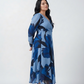 Curve fit crepe dress with a V-neckline and side slit, designed to flatter the upper body and add movement