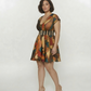 Curve fit mini dress with a structured striped waistband and geometric abstract print, designed to define the waist