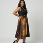 Curve fit modal satin dress with a structured black bodice and patchwork-inspired abstract skirt
