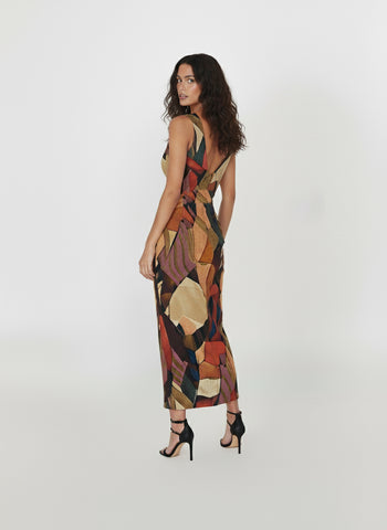 Lightweight Chinon maxi dress with a deep V-neckline, straight-flowing silhouette, and mosaic-inspired abstract print in rust, mustard, teal, and maroon.