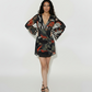 Deep V-neck abstract print mini dress with billowing sleeves, suitable for brunch dates and city strolls