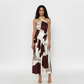 Halter-neck two-piece set with a knot-detail cropped top and a high-waist wrap skirt in a geometric abstract print in mocha and cream tones