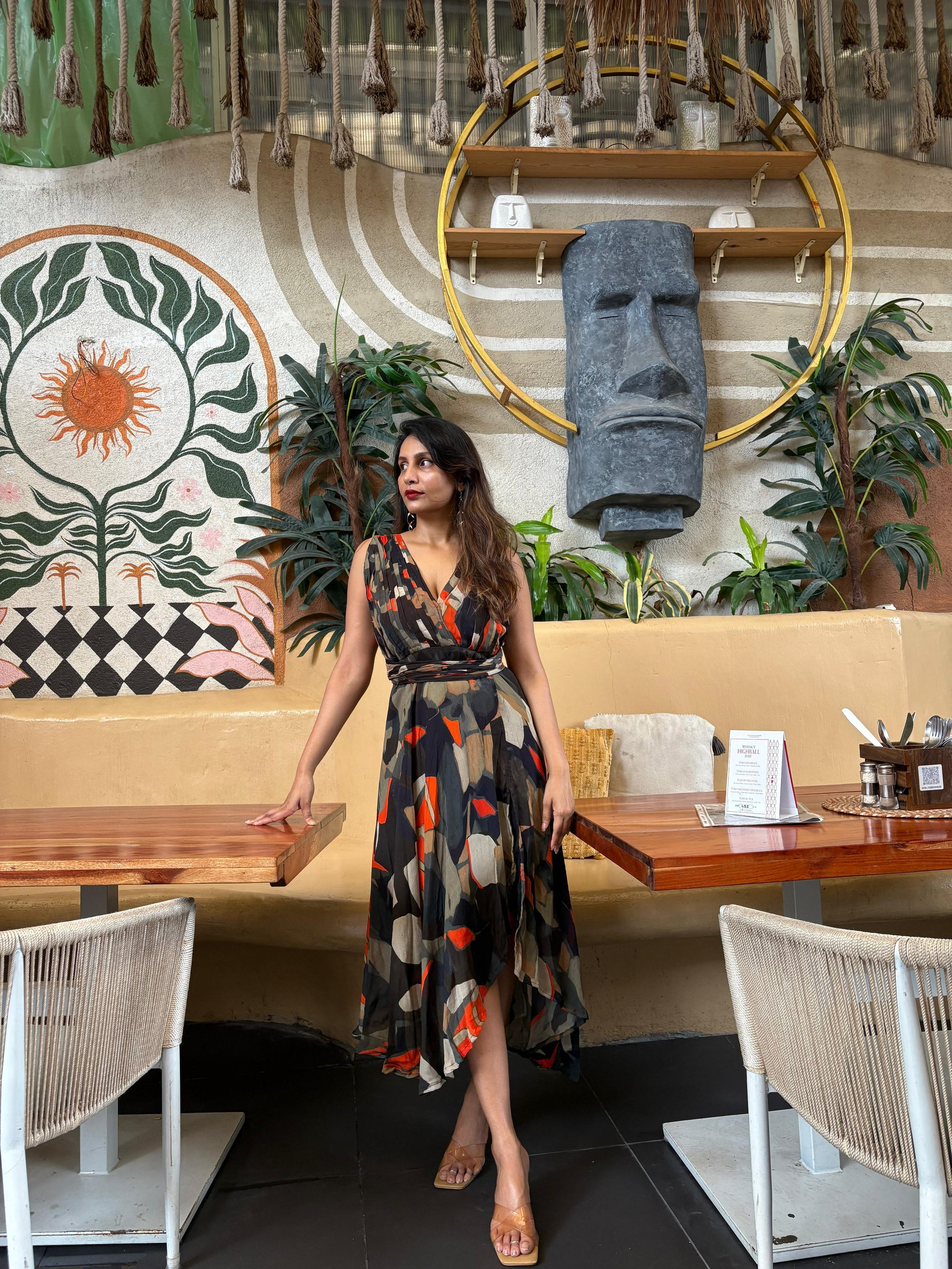 Halter-neck abstract print maxi dress with a front slit, suitable for resort getaways and vacation evenings