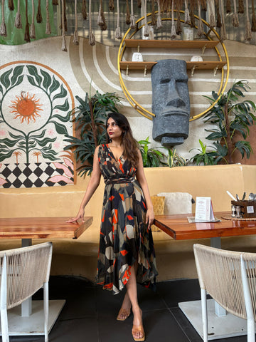 Halter-neck abstract print maxi dress with a front slit, suitable for resort getaways and vacation evenings