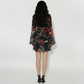 Back view of Deep V-neck abstract print mini dress with billowing sleeves, suitable for brunch dates and city strolls