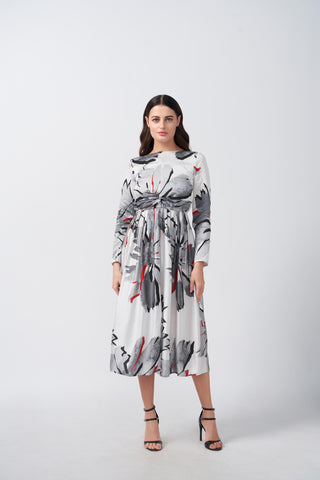 A midi-length dress showcasing a sophisticated white and grey abstract floral print with warm red accents, finished with long sleeves for a polished look.
