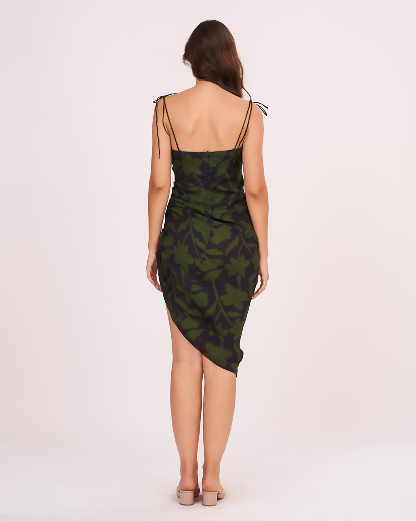 Straight back neckline featuring a concealed central zipper closure and delicate adjustable tie-up shoulder straps.