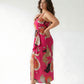 Extended size abstract print dress with a front slit, perfect for parties, vacations, and evening plans