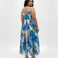 Extended size floral maxi dress with a flowing pleated skirt, perfect for parties, celebrations, and evening occasions