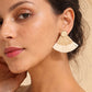 Gold fan-shaped straw earrings with a woven raffia texture and a small gold stud, perfect for a bohemian summer look.