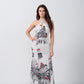 Model in a white and grey ankle-length satin dress with halter neck and red floral accents, standing front-facing.