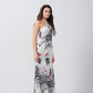 Full frontal pose of model in ankle-length floral satin dress with tie-back halter neckline.