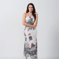 Model in halter neck satin dress walking with a side angle, showcasing soft fabric movement.