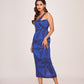 Full-length walking pose of model in one-strap silk dress with fitted silhouette and digital floral pattern.