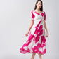 Model walking in a pink and white V-neck midi dress with puff sleeves, showing graceful movement.