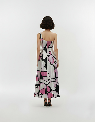 Back view of a one-shoulder crepe maxi dress featuring an asymmetric neckline, fitted waistband, and a flowy A-line silhouette.