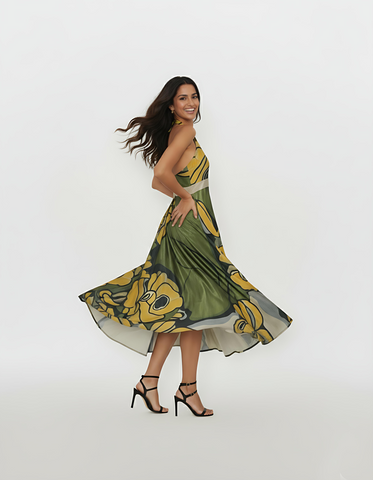 Flowing midi-length dress crafted from a lightweight, airy fabric that offers a draped silhouette and graceful movement through the skirt.