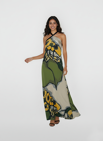 Sleeveless halter-neck dress crafted from a breezy, smooth crepe material that captures movement through its voluminous hemline. This piece features a striking mix of organic shapes and bold outlines, offering a modern take on seasonal floral dressing.