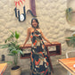 Abstract print maxi dress in deep navy, olive green, warm beige, and fiery orange tones
