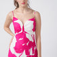 Pink and white floral full-length crepe dress with ruched detailing, suitable for upscale gatherings and formal events