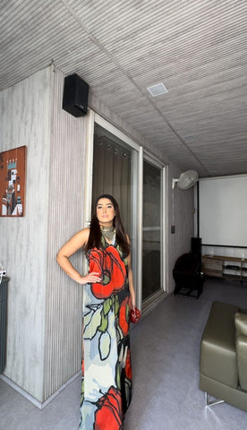 Bold botanical print dress with a sweeping silhouette, ideal for tropical resort wear, summer evening events, or outdoor garden parties.