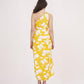 Rear view of the yellow floral co-ord set, showcasing the back cut of the skirt and the single-shoulder strap styling.