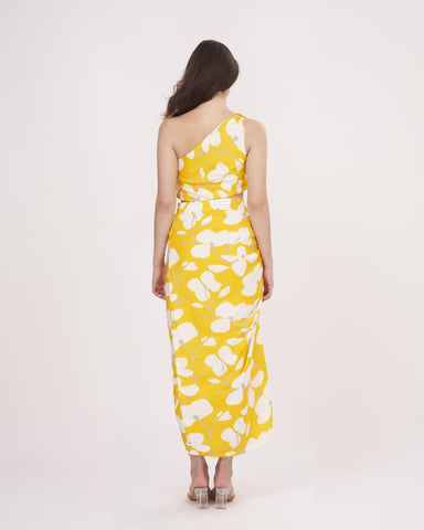 Rear view of the yellow floral co-ord set, showcasing the back cut of the skirt and the single-shoulder strap styling.