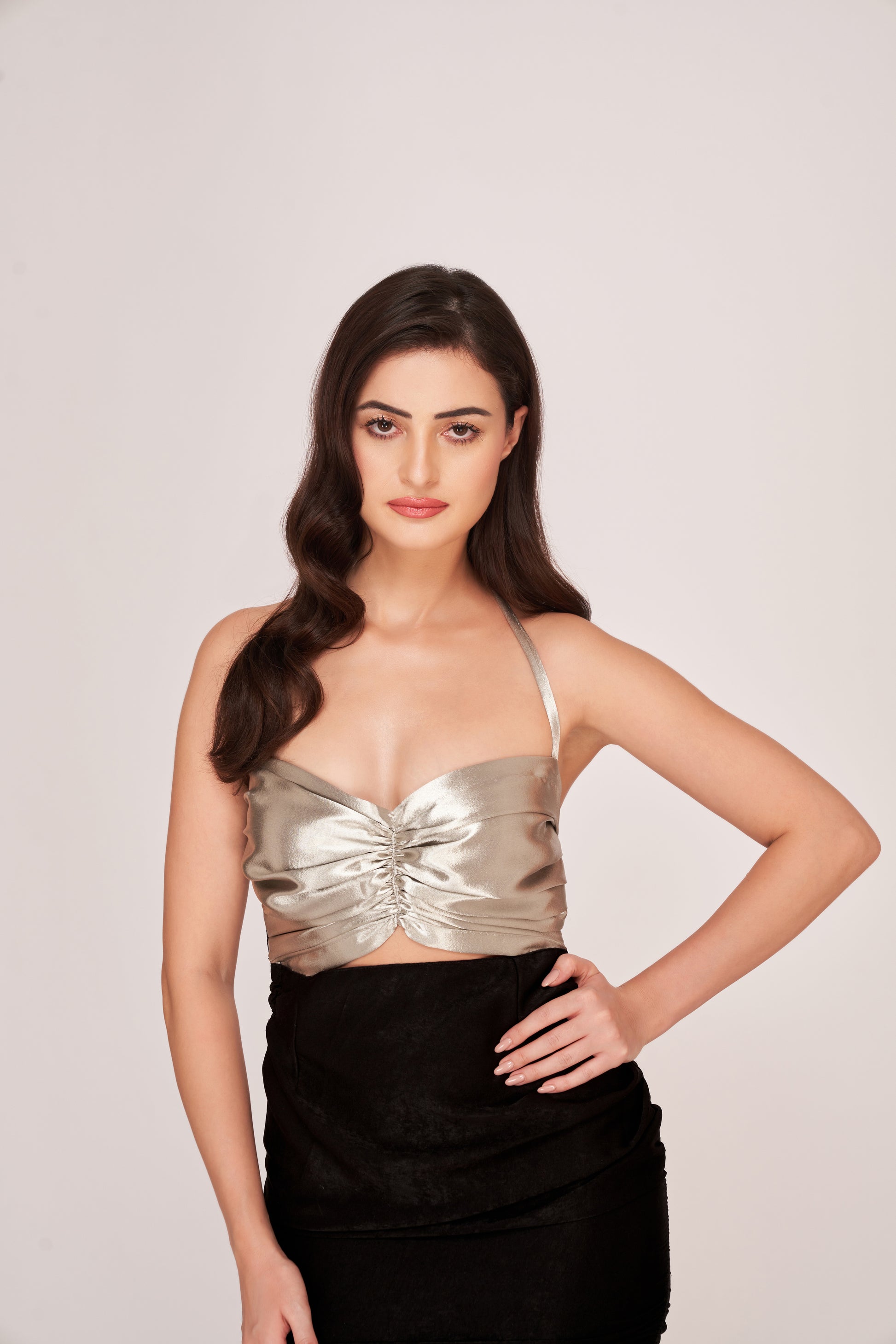  Model showcasing front cut-out and side ruched detailing in a black and silver sweetheart neck dress.