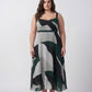 Detail of fluid crepe fabric drape on a green abstract midi dress, offering soft movement without clinging
