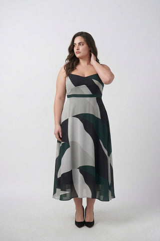 Green abstract crepe midi dress with delicate shoulder straps, designed for a flattering and elegant resort-ready look
