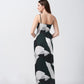 Rear view of the dress showing the tie-back and elegant fall of the abstract satin fabric.
