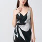 Close-up view highlighting the neckline and spaghetti straps of the satin wrap dress.