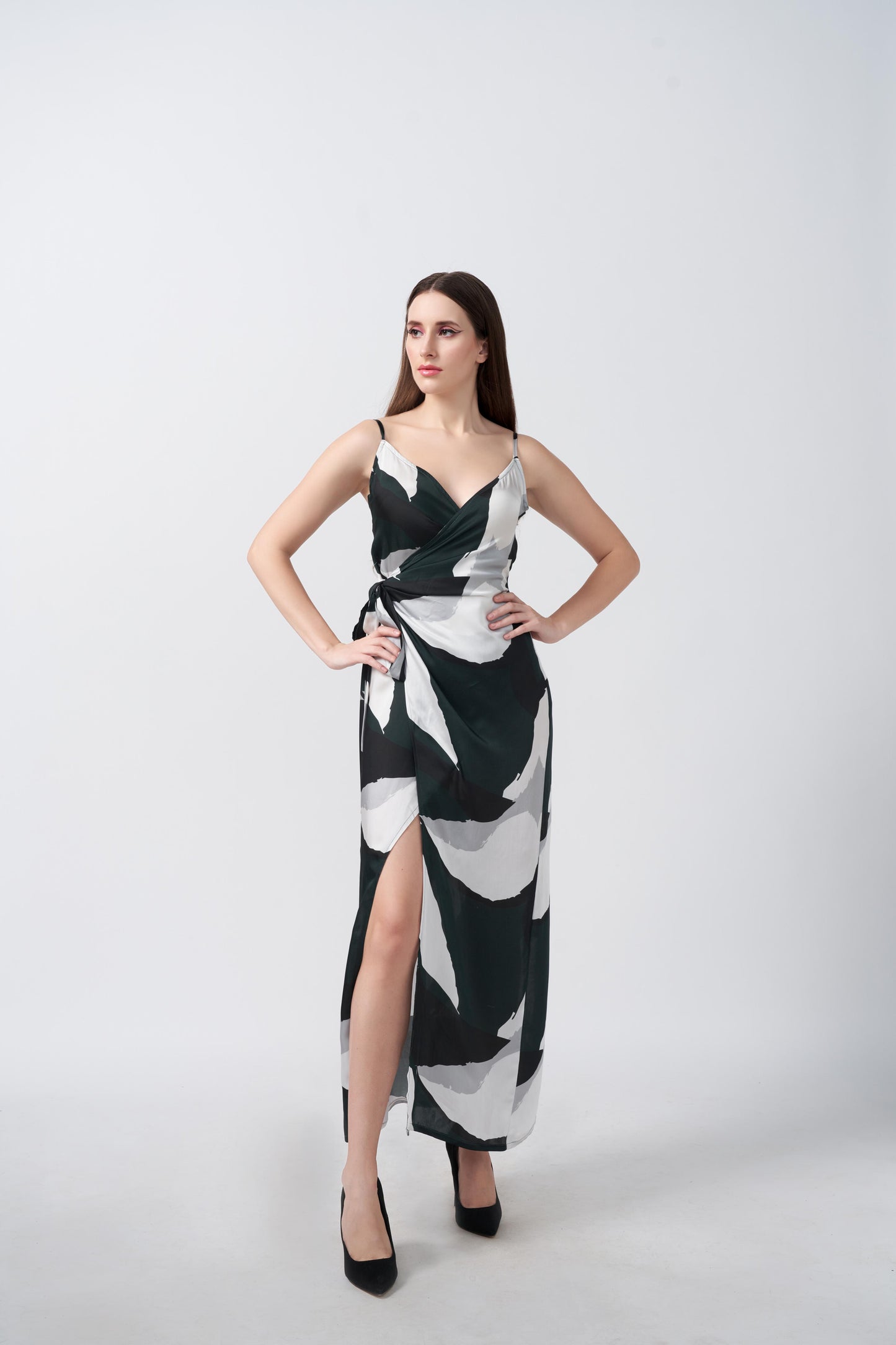  Model posing with hand on waist, showcasing the fitted wrap silhouette of the satin dress.