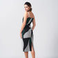 Model in side stance wearing abstract crepe dress with square neckline, emphasizing the contour fit and graphic design.