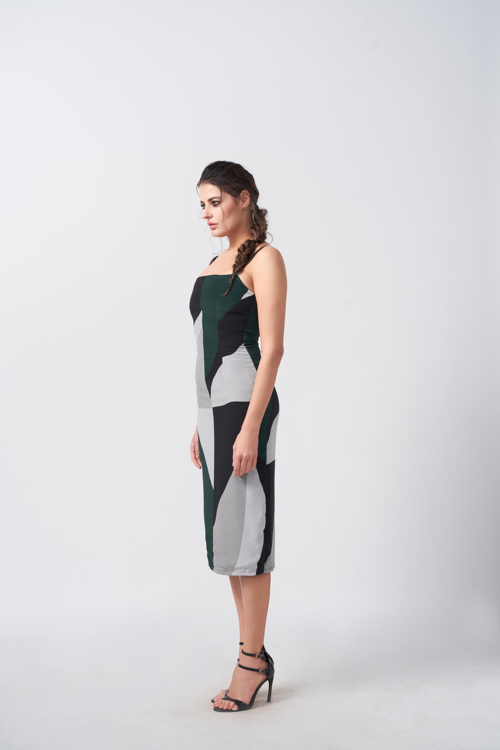 Model walking in green and grey abstract midi dress, showing the smooth drape and confident styling.