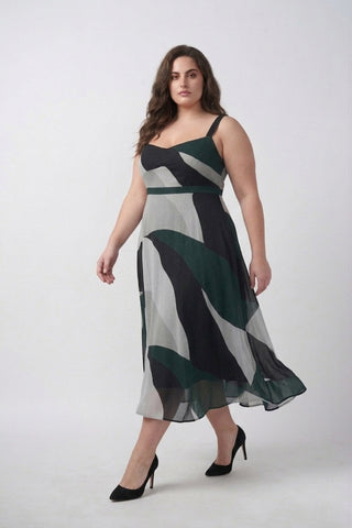 Flowy crepe midi dress featuring green, black, and grey abstract print with a graceful silhouette for elevated daytime styling