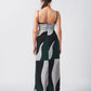 Rear view of green abstract print crepe dress, highlighting open-back and adjustable spaghetti strap design.